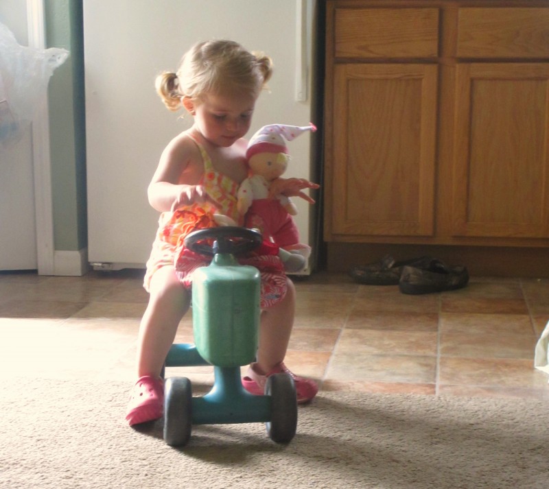 Kelsie Playing On Tractor With Baby Dolls