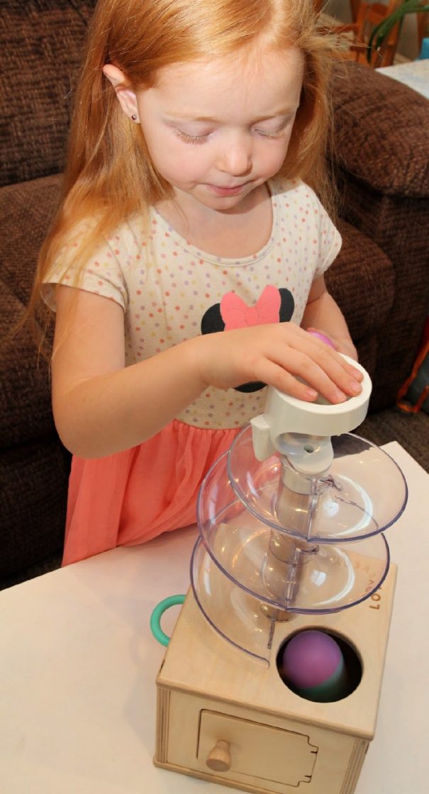 Slide And Seek Ball Run: Balls roll down and disappear into a wooden box—a fun lesson in object permanence.