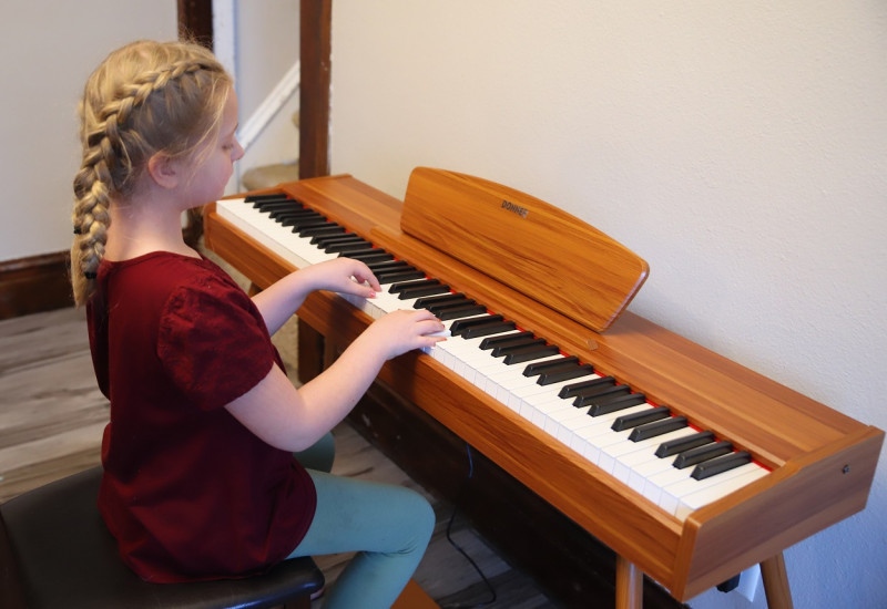 playing a donner piano