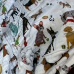 little unicorn woof quilted throw