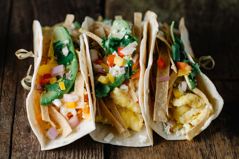 Breakfast tacos on a wooden background