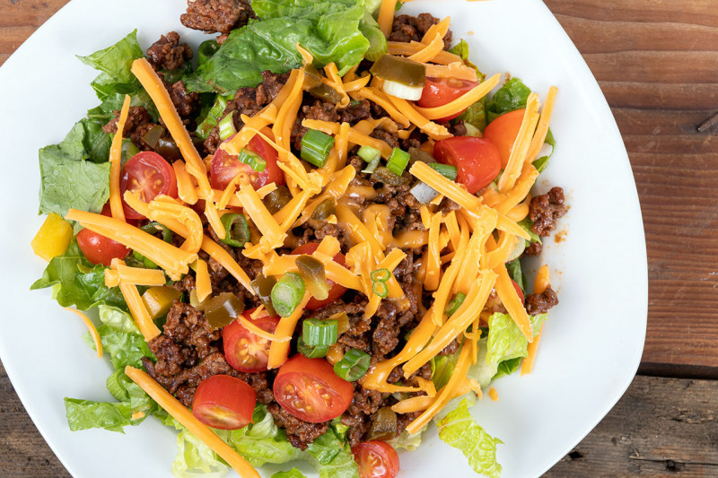 Taco salad on a white plate.