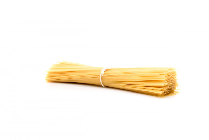 Raw spaghetti on white background