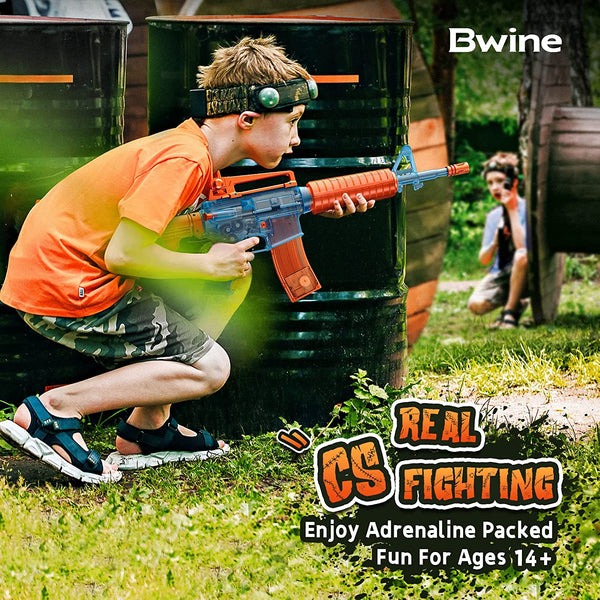 Child hiding in cover while holding a Bwine M4A1 Electric Gel Ball Blaster