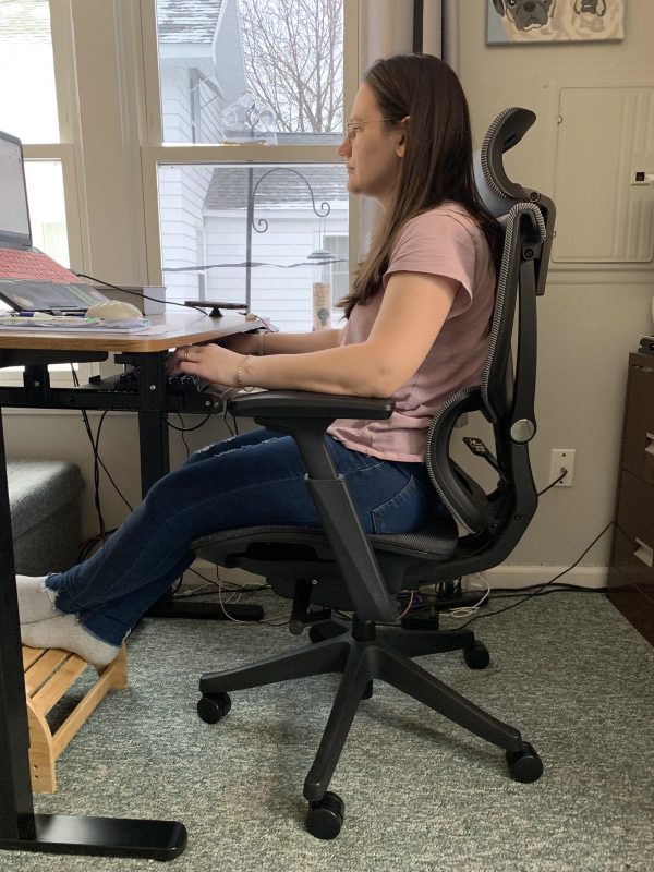 Woman sitting in a Flexispot C7 Chair
