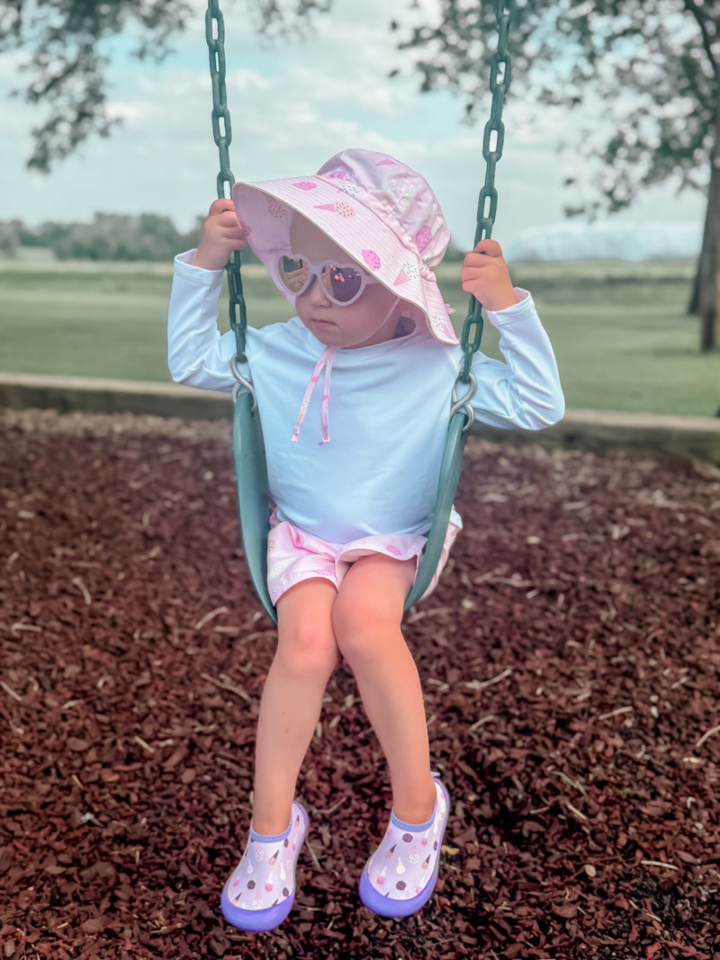 Girl on swing. Minnesota Summers For Our Farm Family.