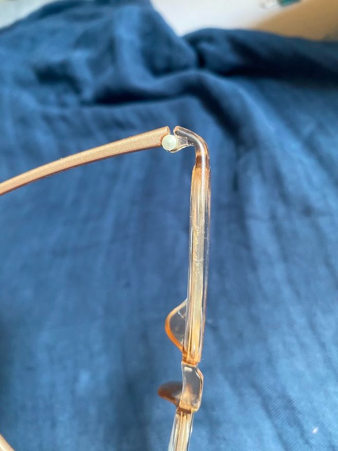 dirt trapped in frames of clear transparent glasses frames 